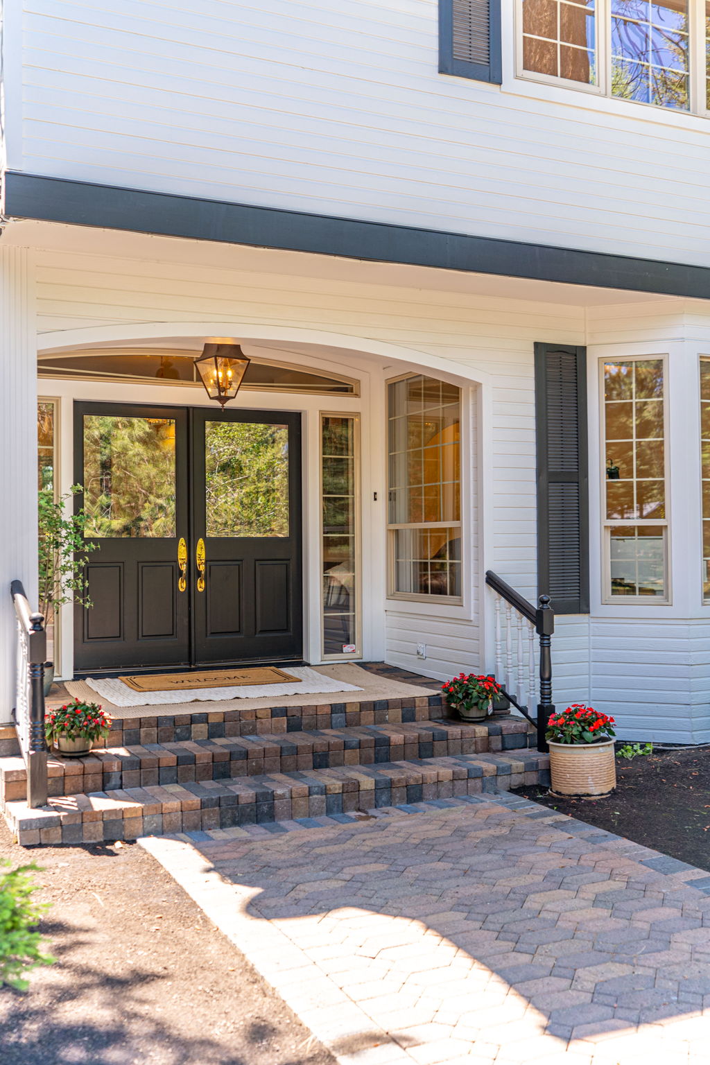 Farmhouse style lighting and covered entry