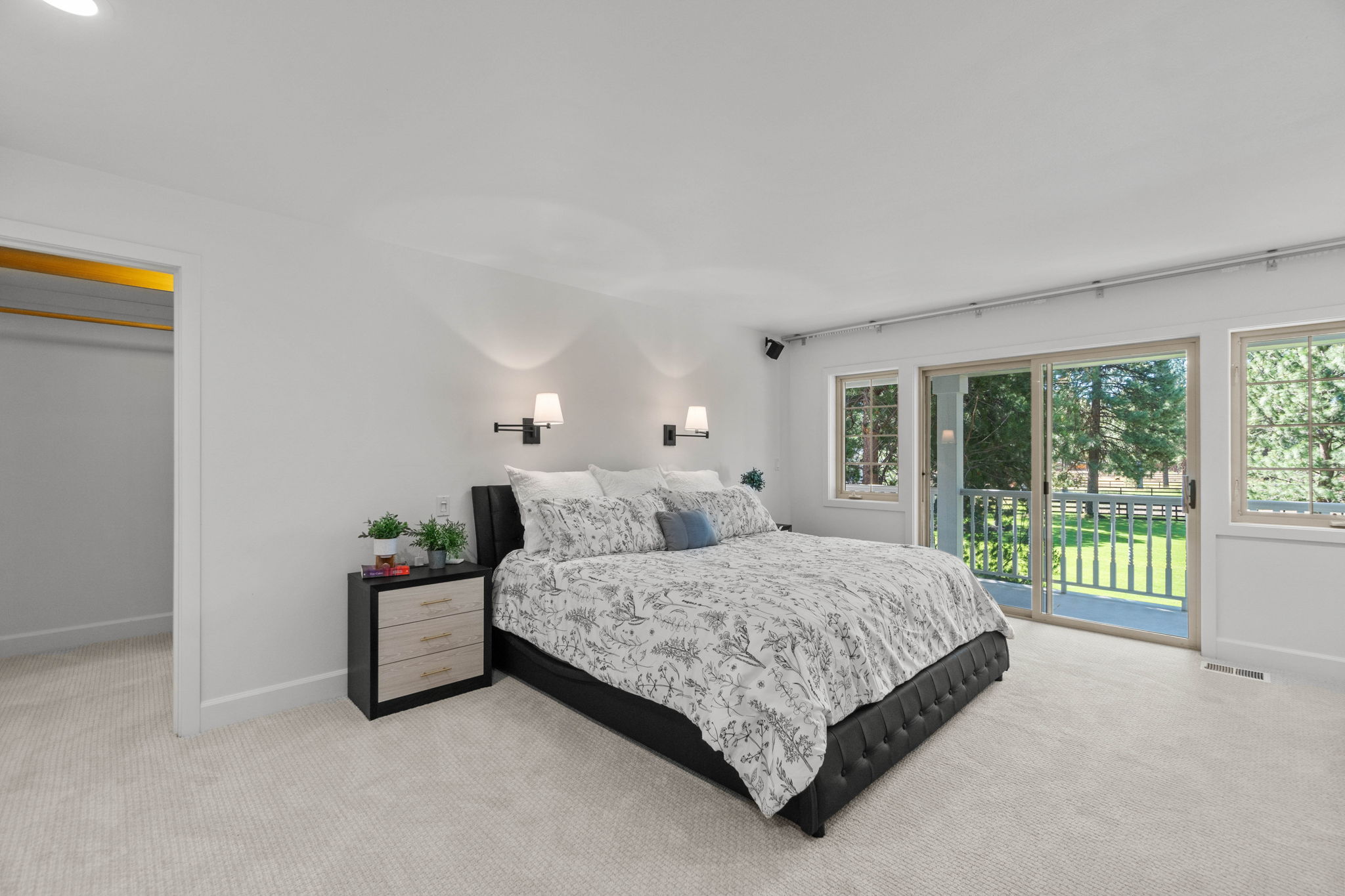 Upper level, spacious Primary bedroom with en-suite bath, 3 spacious walk-in closets with shelving & built-ins