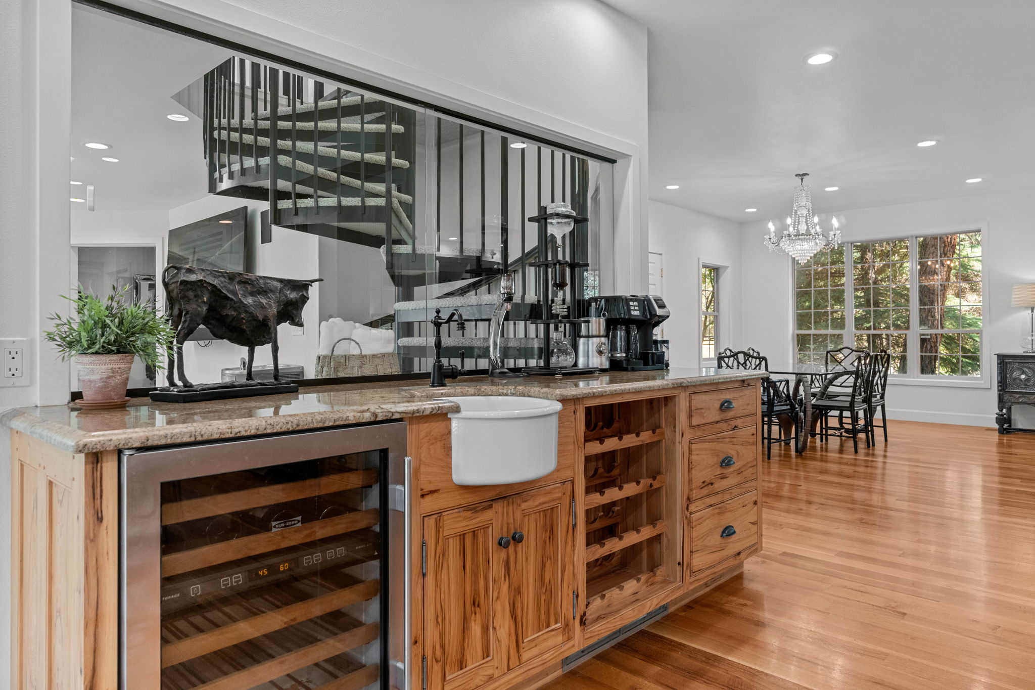 Wet bar with SubZero Wine Fridge, wine rack,  & round farmhouse sink