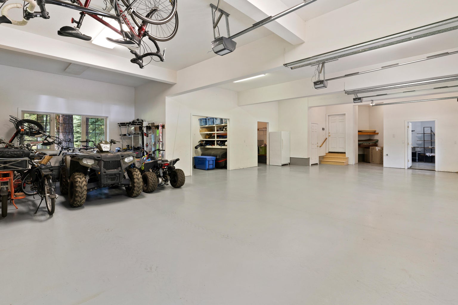 Garage has private access to upper guest quarters with full bathroom, kitchen area and private access to lower level finished basement, game room & storage