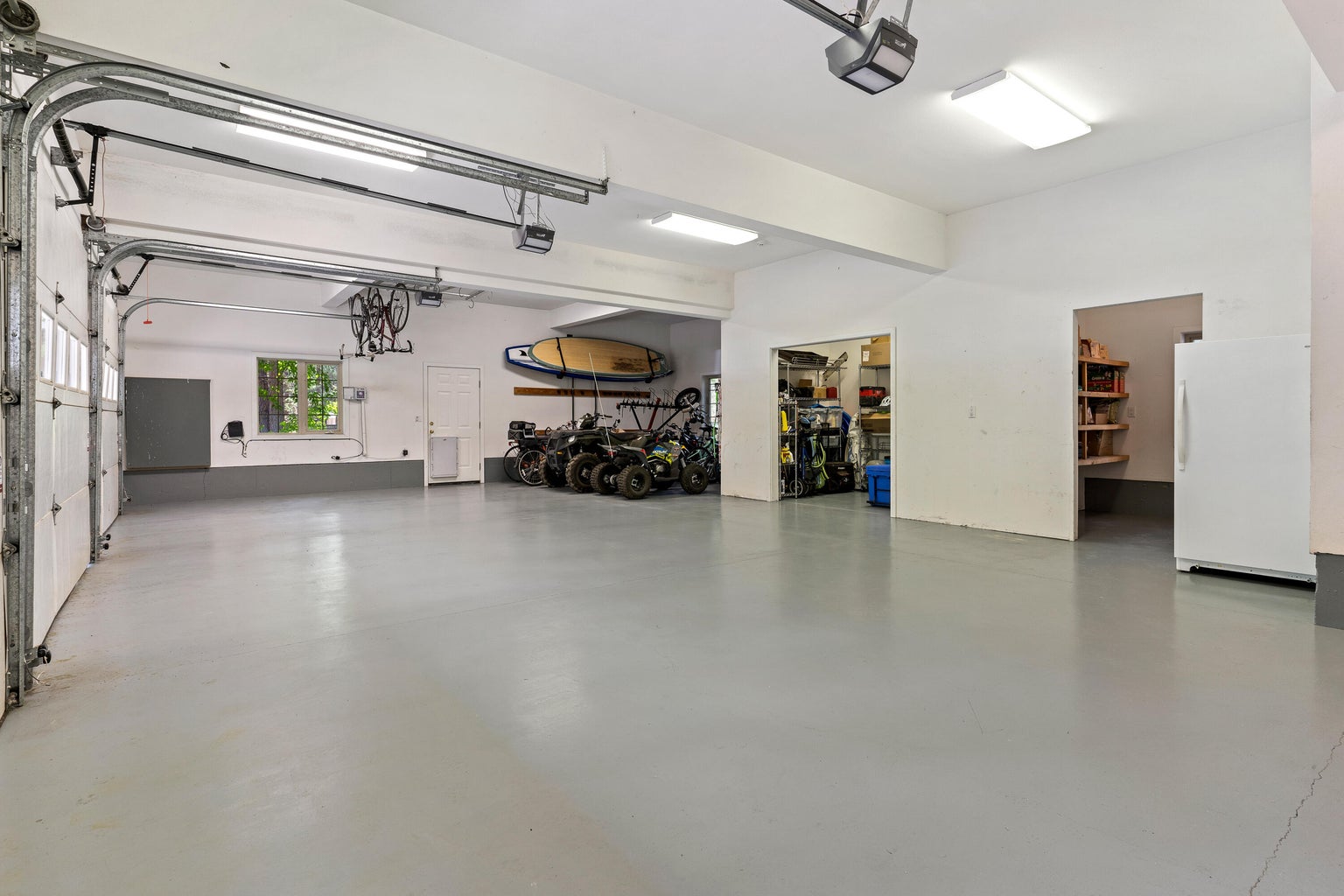 4 car garage with storage/work shop