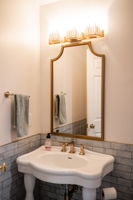 Pedistal sink, new lighting and plumbing fixtures