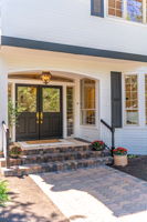 Farmhouse style lighting and covered entry