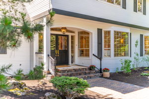 Welcoming Double door entry with paver walkway