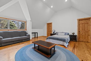 Guest bedroom #3 with full guest quarters above garage