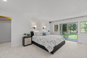 Upper level, spacious Primary bedroom with en-suite bath, 3 spacious walk-in closets with shelving & built-ins