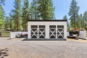 Equipment shed behind barn