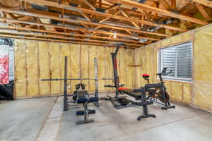 Unfinished basement with multiple egress windows
