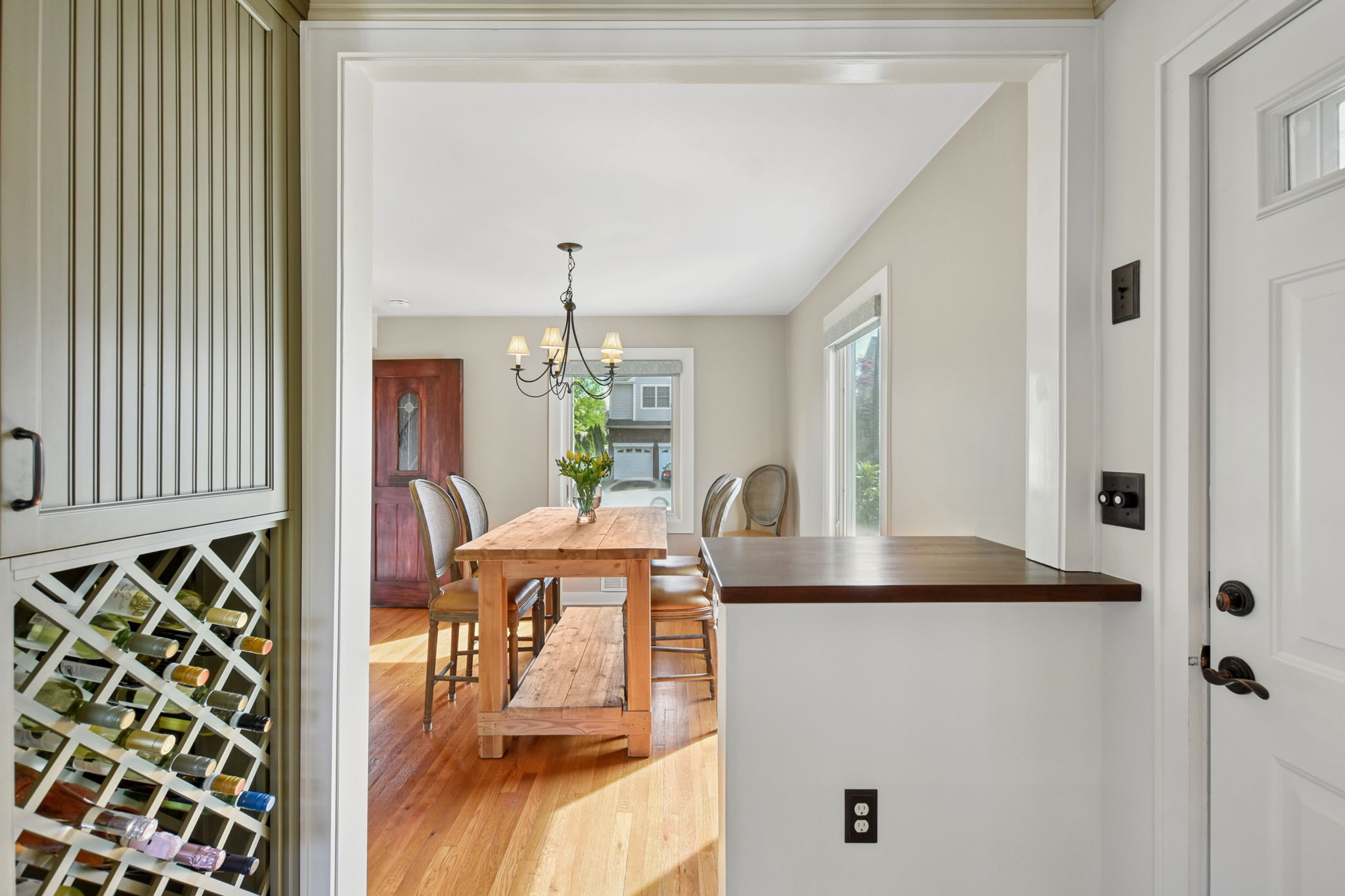 Sophisticated dining area. Custom shades, hard wood floors & central air throughout.
