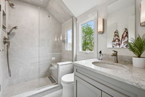 New, serene, and totally spa-worthy—this second-floor bath is pure shower bliss.