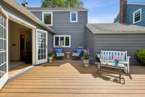 Morning coffee and evening breezes await on the comfy TREX back deck