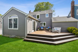 Family room leads out to back deck - idyllic outdoor space to relax and unwind after a long day.