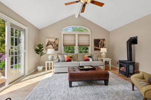 Welcome home to inviting retreat with this spacious "surprise" family room with a cozy electric Vermont stove.  You can truly visualize the flow by referring to the floorplans