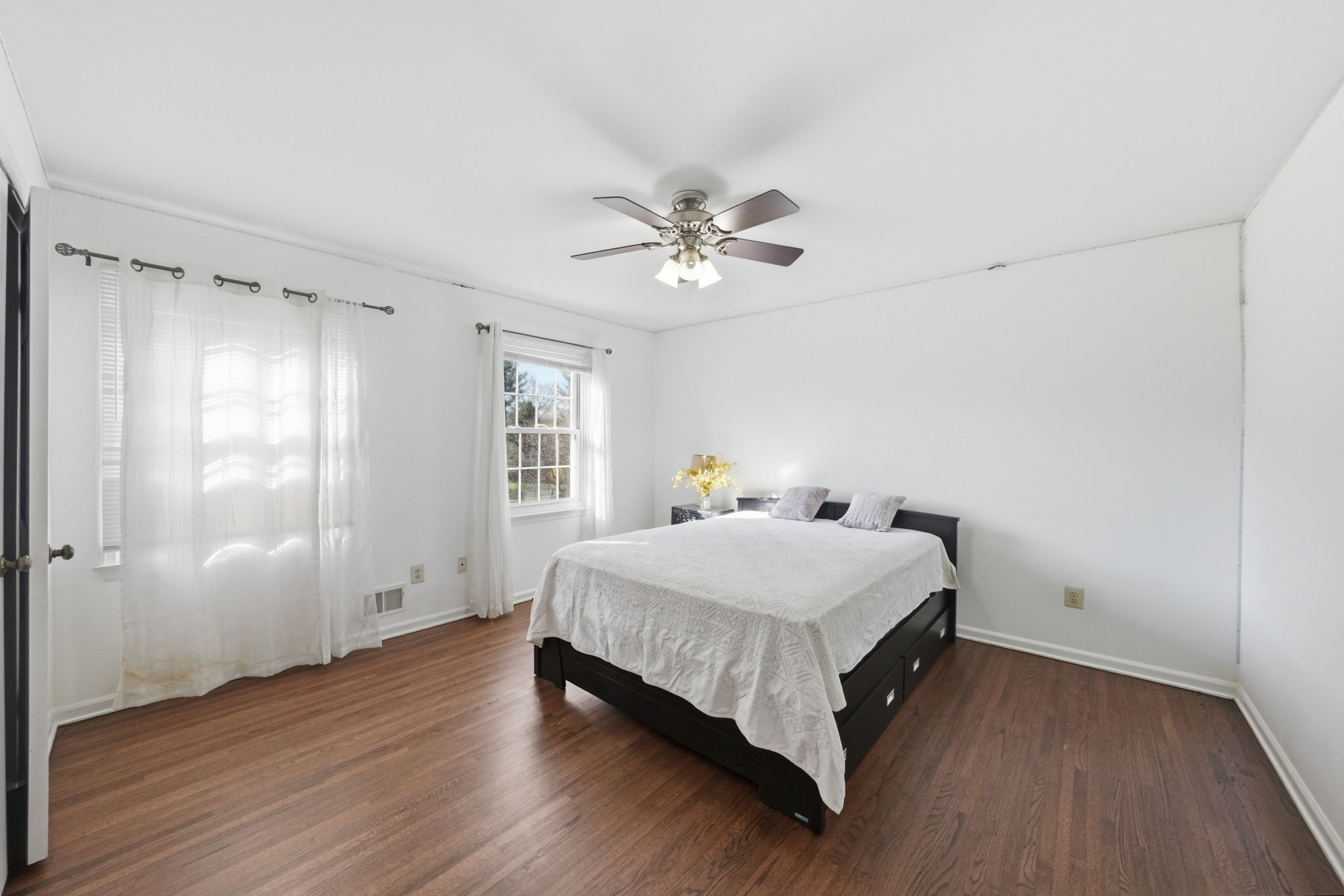 Bedroom with hard wood flooring