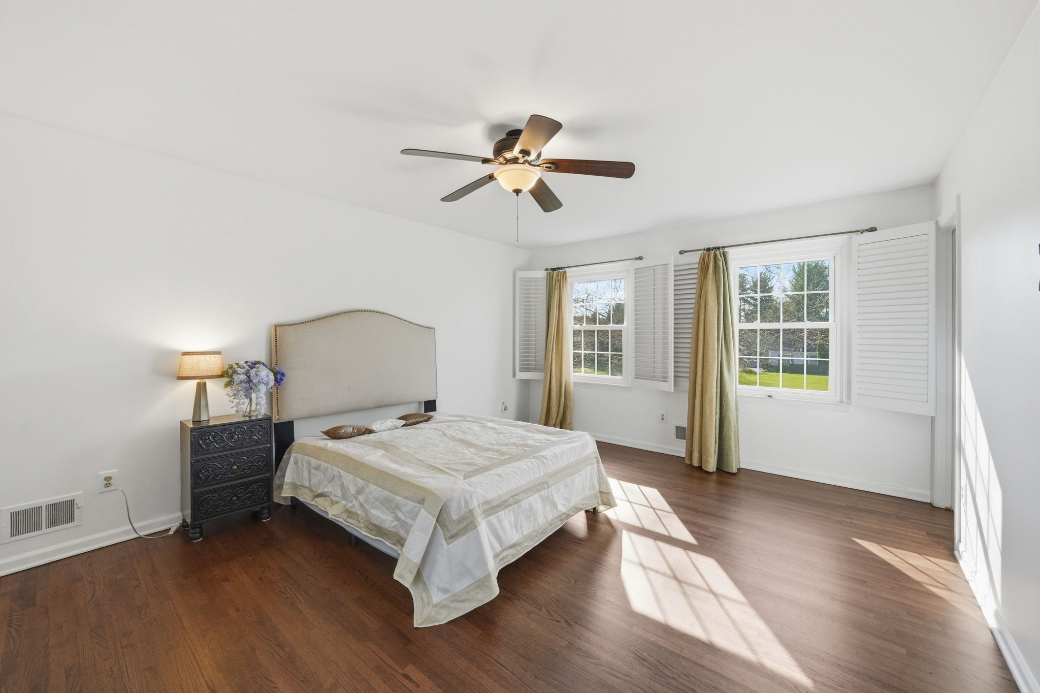 Bedroom with hard wood flooring