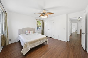 Bedroom with hard wood flooring