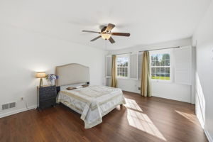 Bedroom with hard wood flooring