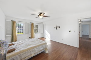 Bedroom with hard wood flooring