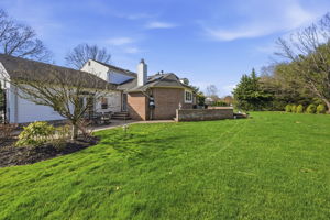 Lush backyard with brick walls