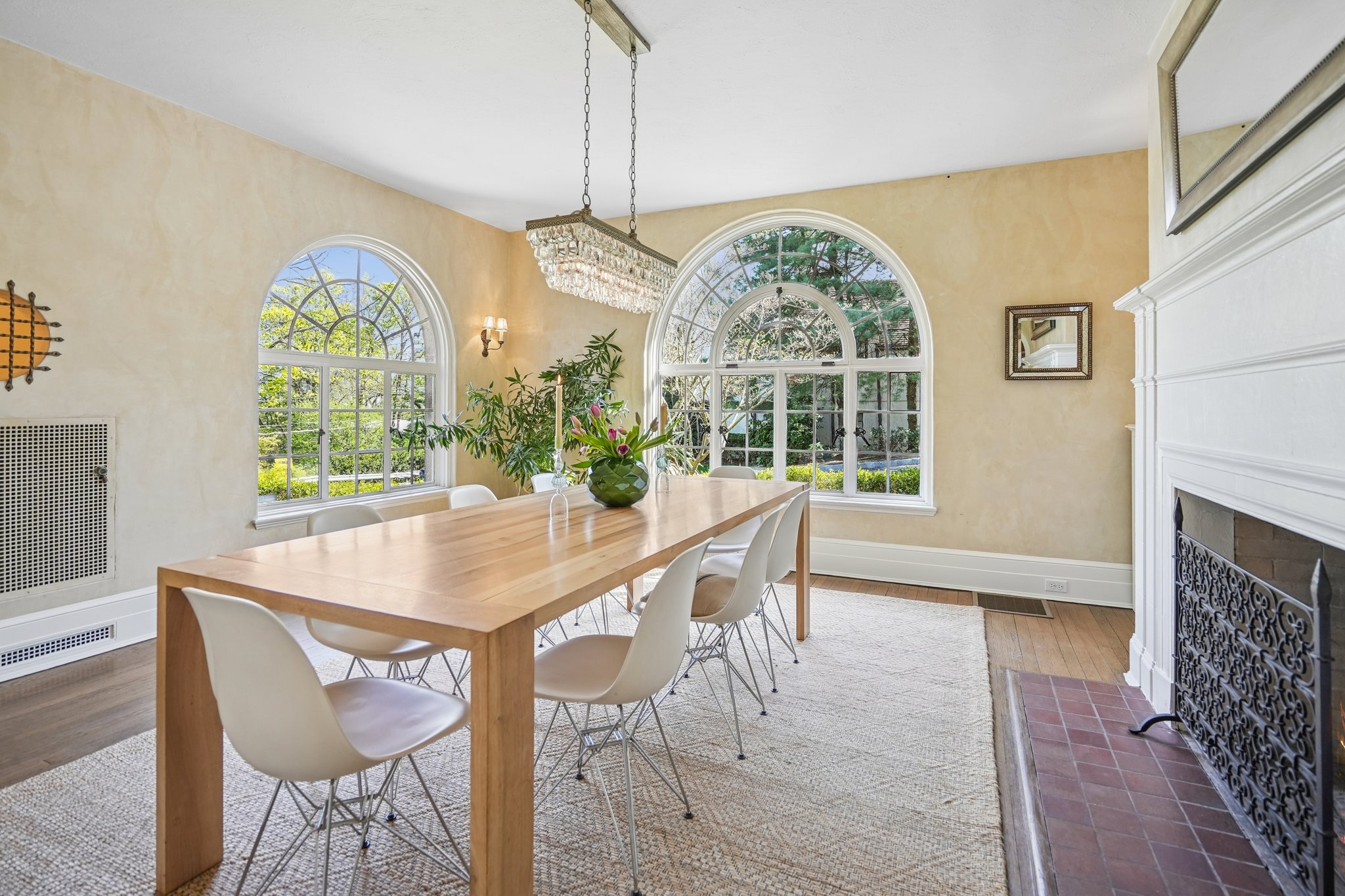 Venetian plaster walls, curved windows, and a gas fireplace that makes every meal feel like an event!