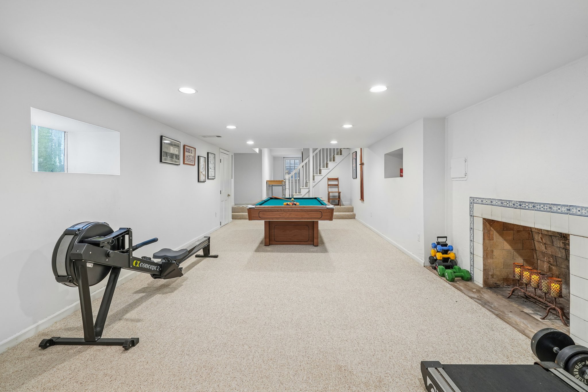 Big enough for your boldest plans. Whether it’s billiards, a home gym, or the ultimate hangout spot, this lower level brings the space—and a decorative fireplace that brings the mood.