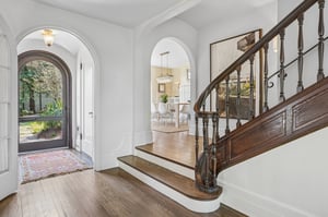 This curved staircase ties everything together. Warm, welcoming, and just the right amount of wow.