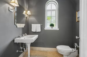 First floor powder room. The house has 4 full baths and one half bath: 2 full baths on 2nd floor, 1 full bath on lower level, 1 full bath plus this powder room on first floor.