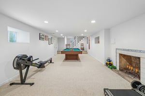 Big enough for your boldest plans. Whether it’s billiards, a home gym, or the ultimate hangout spot, this lower level brings the space—and a decorative fireplace that brings the mood.