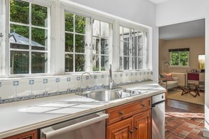 A kitchen that begs for good conversation and looks out onto patio