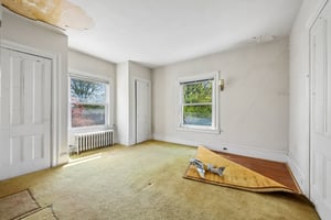 Beneath the carpet, beautiful wood floors are ready to be revealed, while that model plane offers a touching nod to the home’s past - a father who flew in Korea, building memories here. Now it’s your turn to reimagine what comes next.