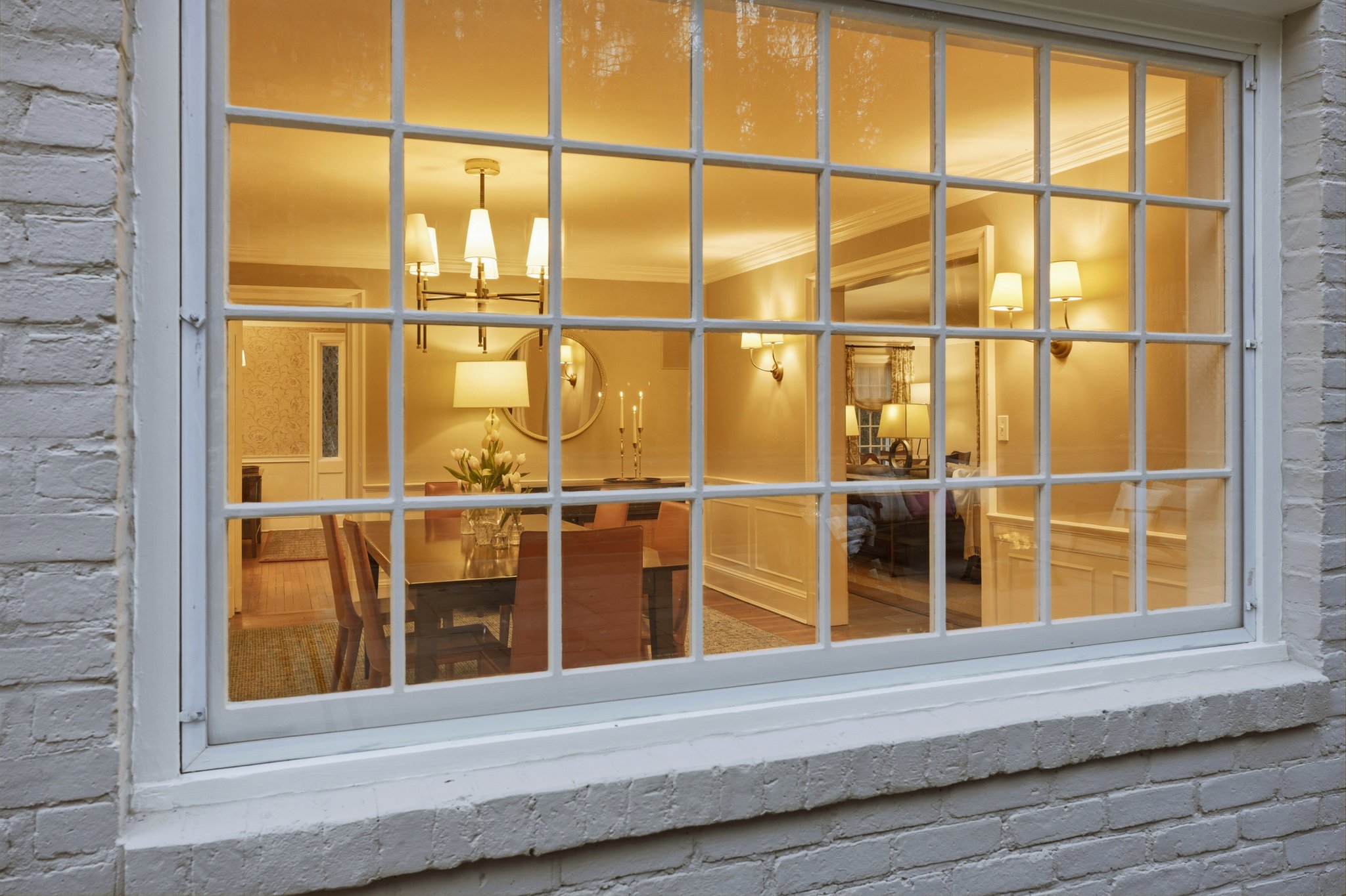 From the outside looking in, the glow says it all - a home that feels as inviting at night as it does by day, with spaces designed for gathering, lingering, and coming together.