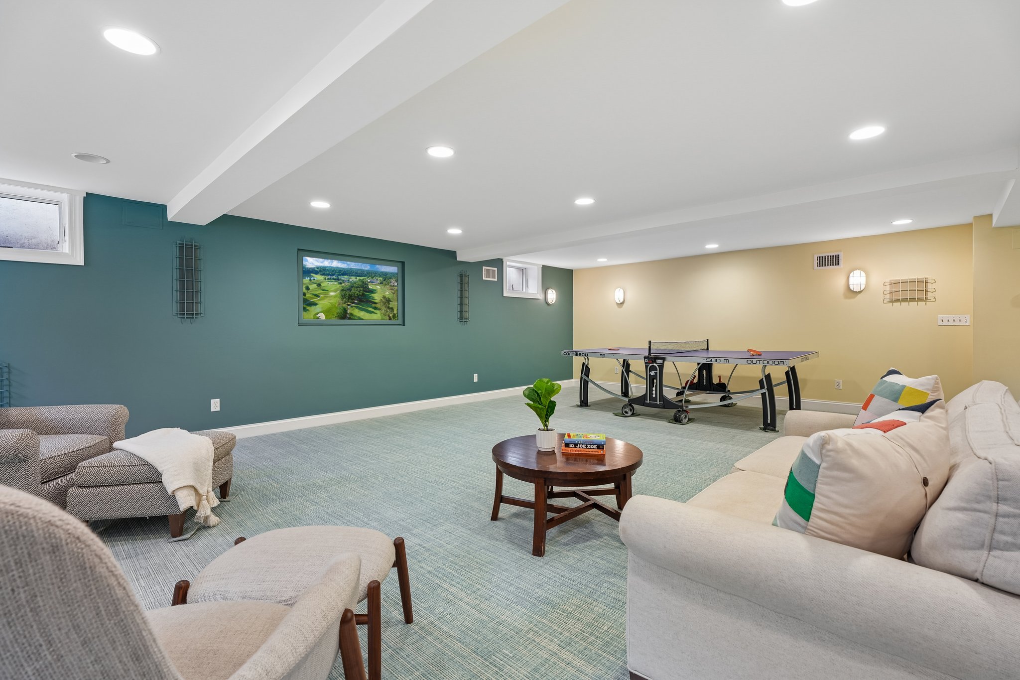Designed for play, gathering, and everything in between - a beautifully finished lower level with space for games, lounging, and effortless entertaining.