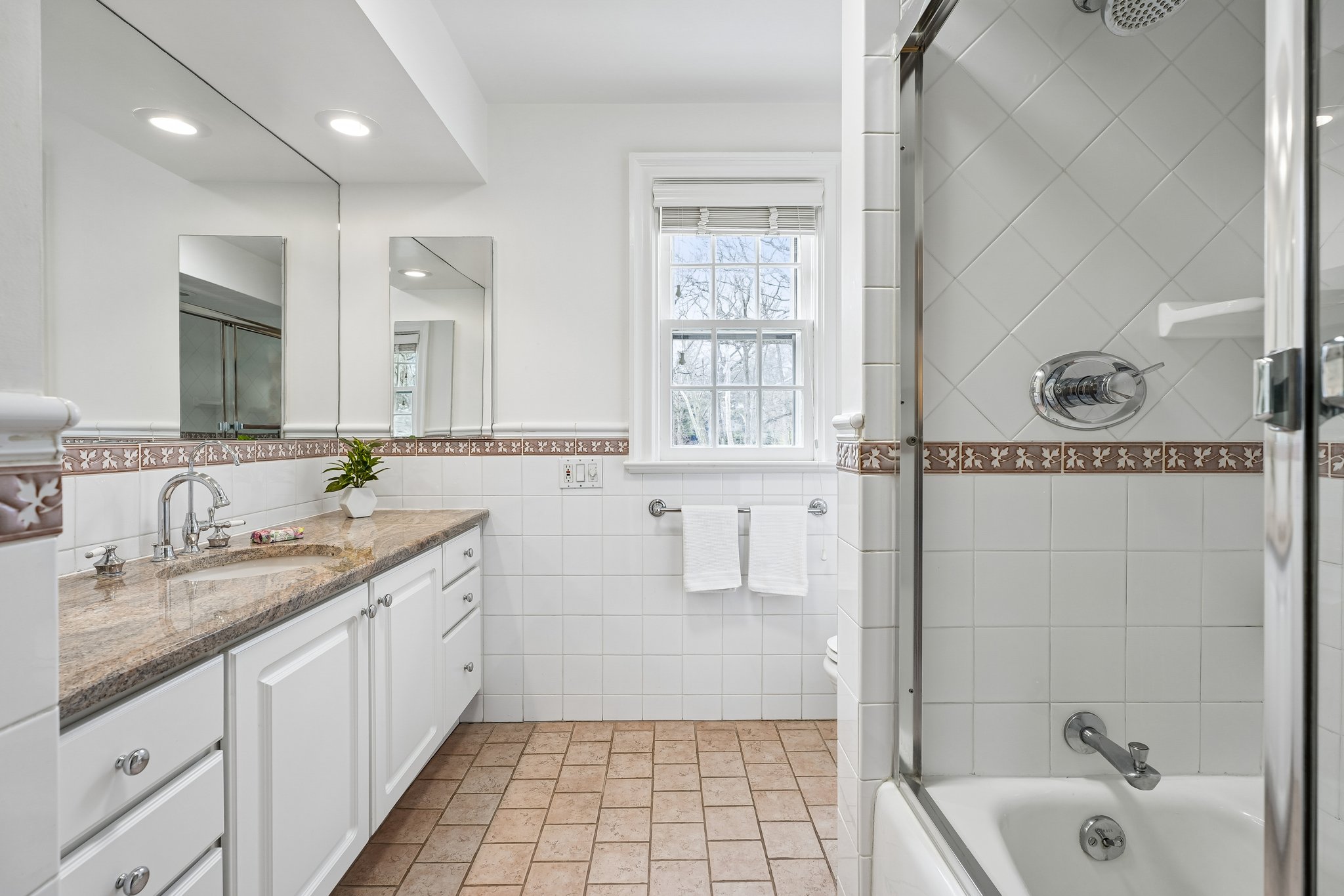 2nd floor has two full hall baths.  Here's #1