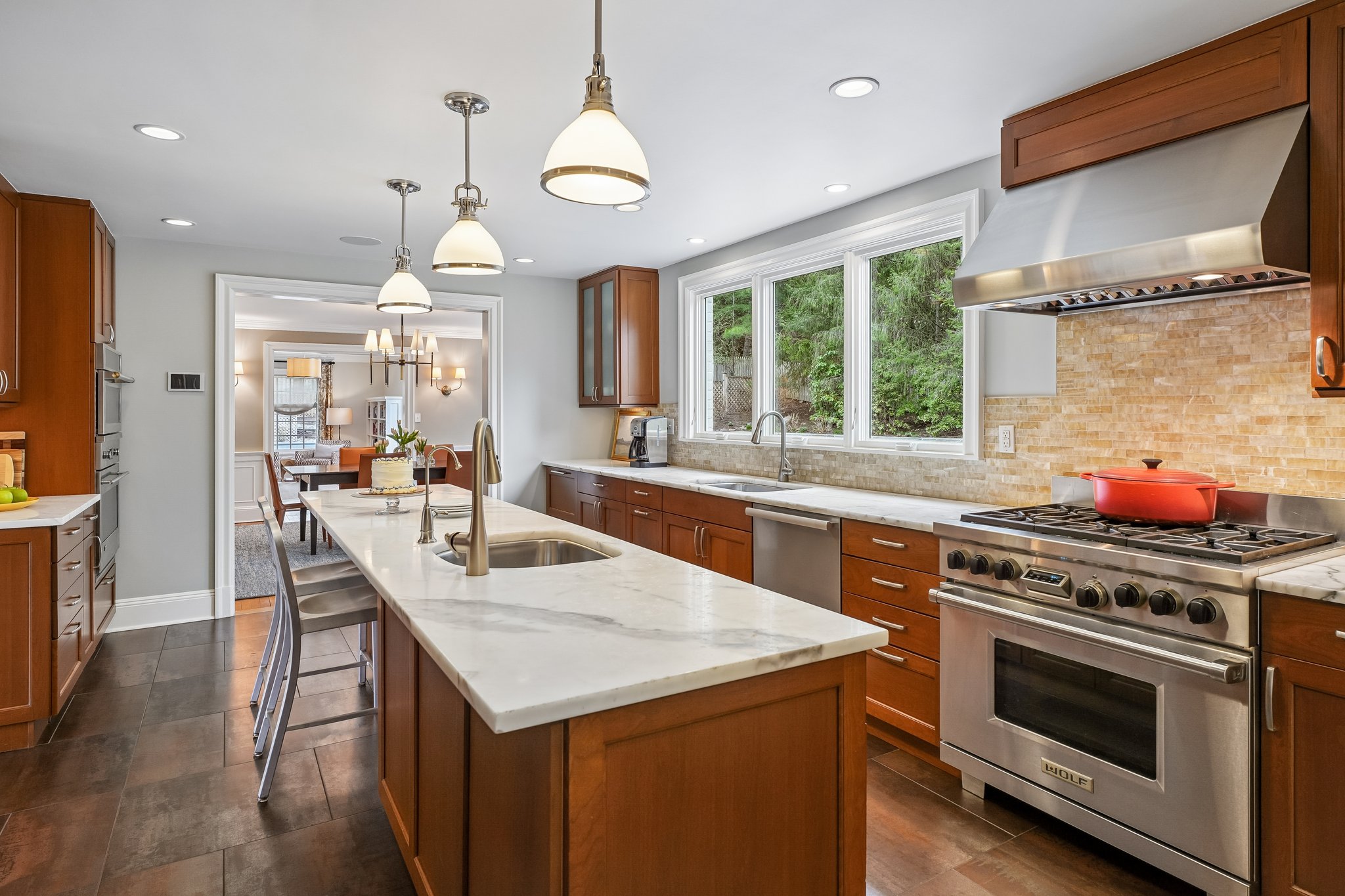 Wash dishes with a relaxing view of the waterfall and fish pond outside the window.