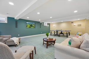Designed for play, gathering, and everything in between - a beautifully finished lower level with space for games, lounging, and effortless entertaining.