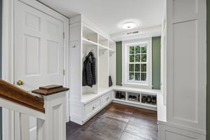 Thoughtfully designed for real life, the mudroom is right off the attached 2 car garage and keeps everything in its place with built-ins, storage, and a seamless blend of function and style.