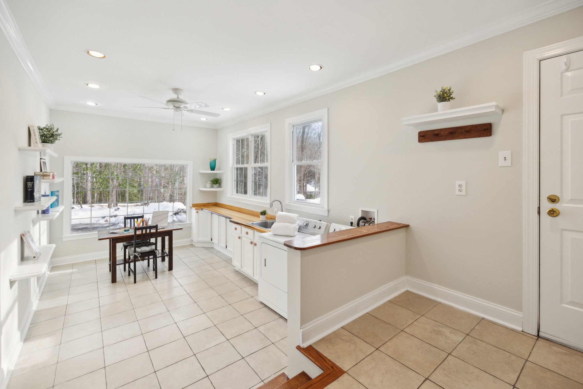 Laundry/ Mudroom with Access to the Rear yard and Garage