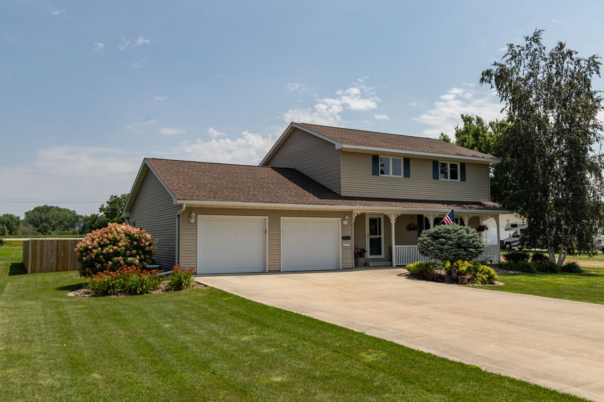 Large Cement Driveway into Attached Double Garage