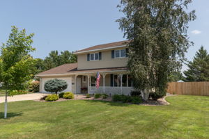 Front of house with covered Porch