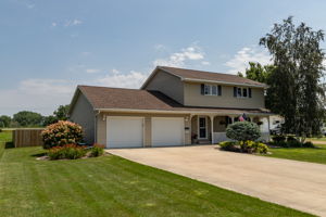 Large Cement Driveway into Attached Double Garage