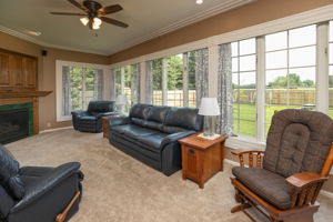 Cozy Sun Room with Built in TV