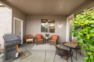 Covered back patio with garage access on left