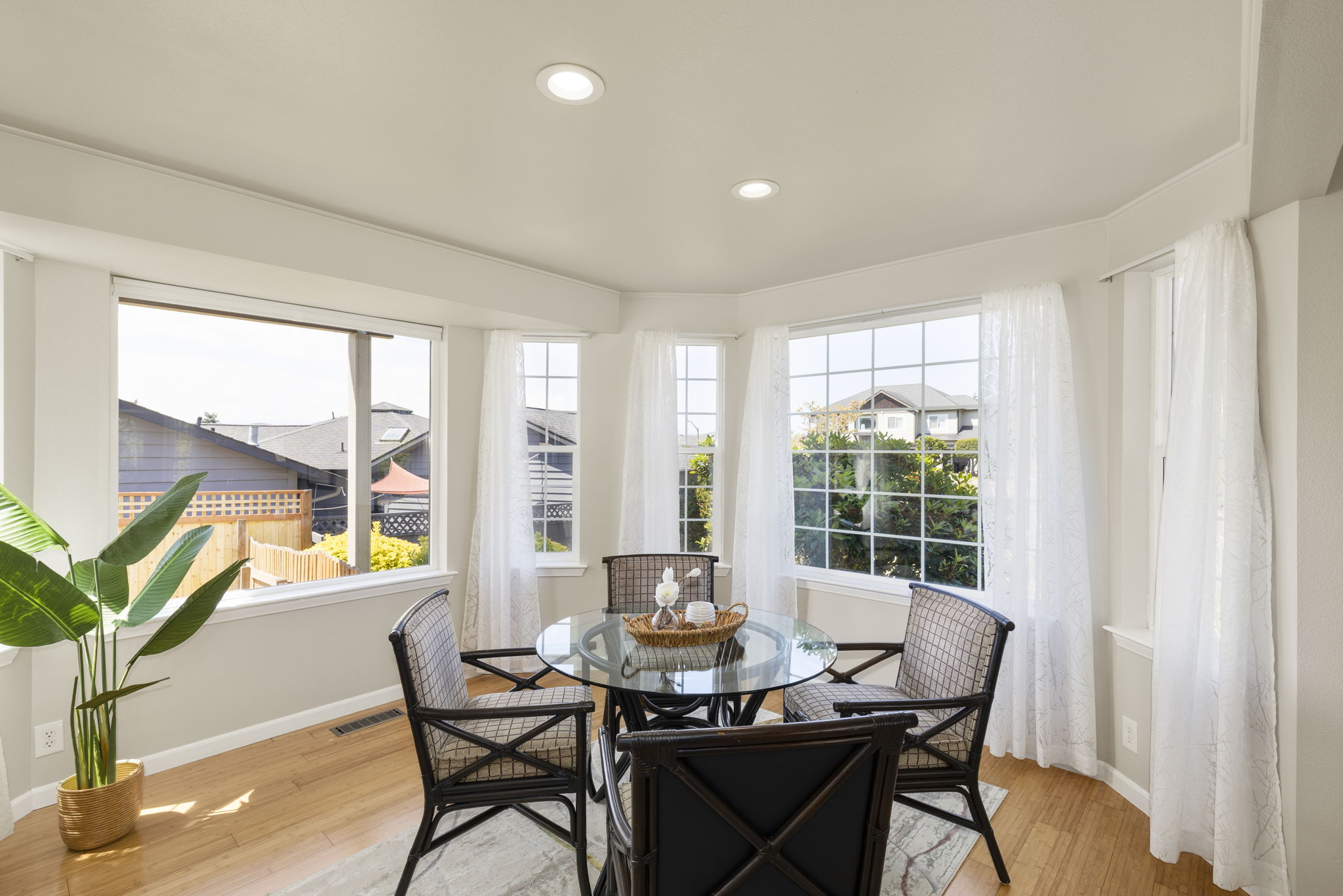 Dining room surrounded by windows and natural light!