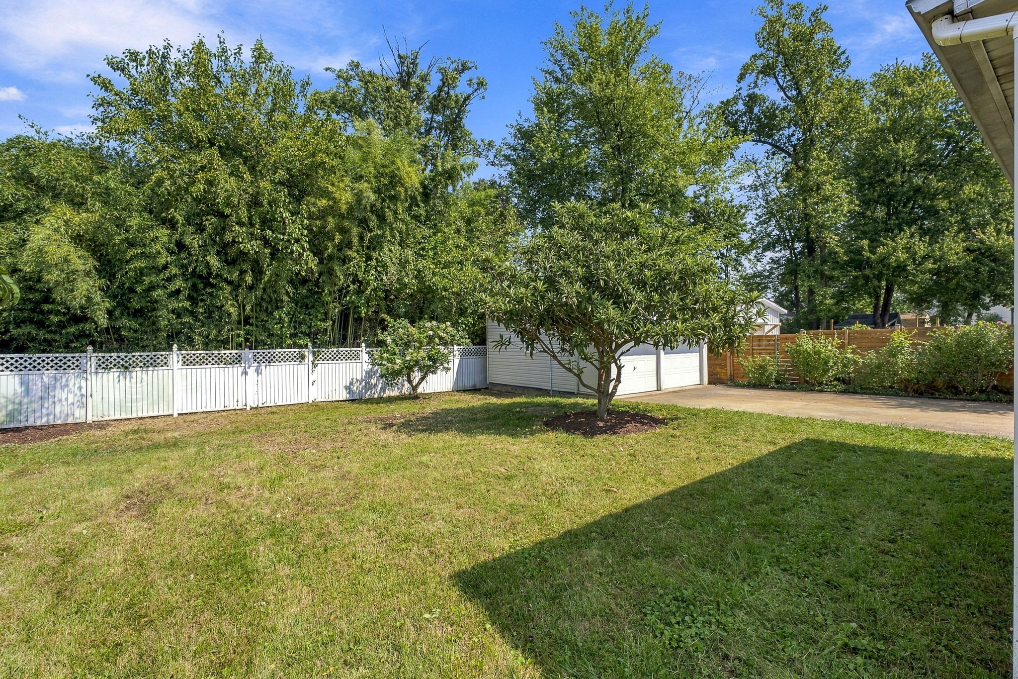 Flat fenced backyard + detached garage