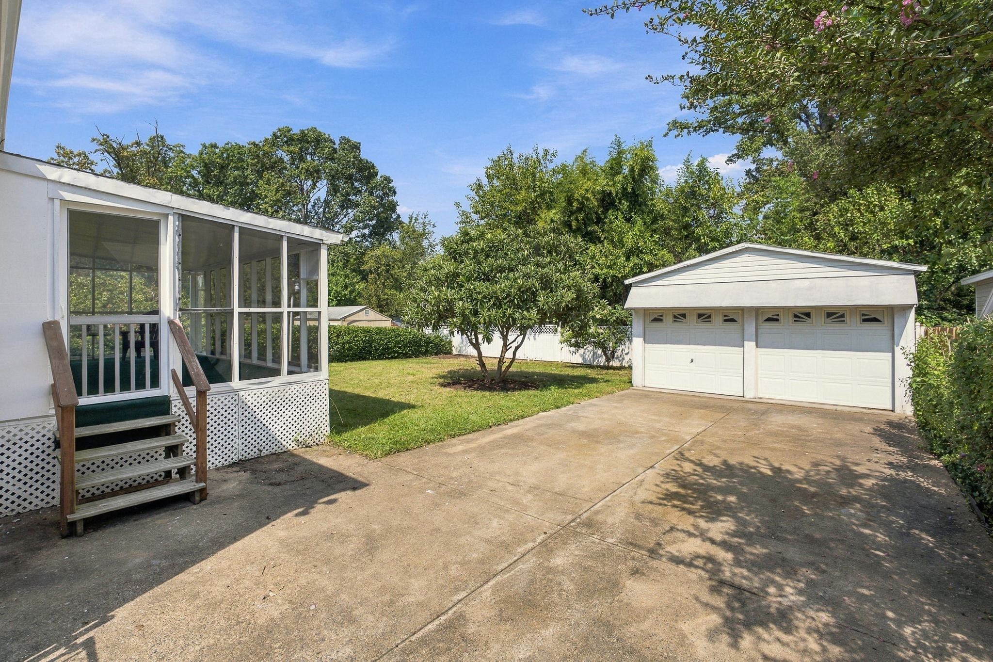 Flat fenced backyard + detached garage