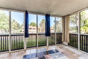 Enclosed balcony area with nice windows and screens