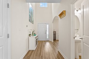 2 story foyer with access to dining room and living room