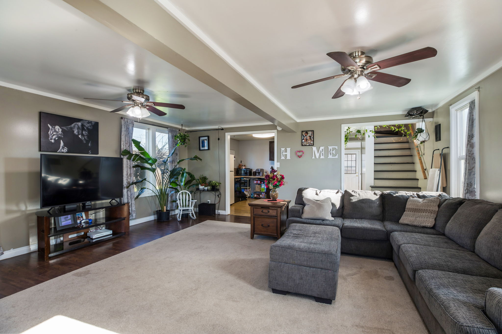 Dining room was by large windows by kitchen