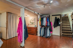 Door next to stairs leads to a great storage room!