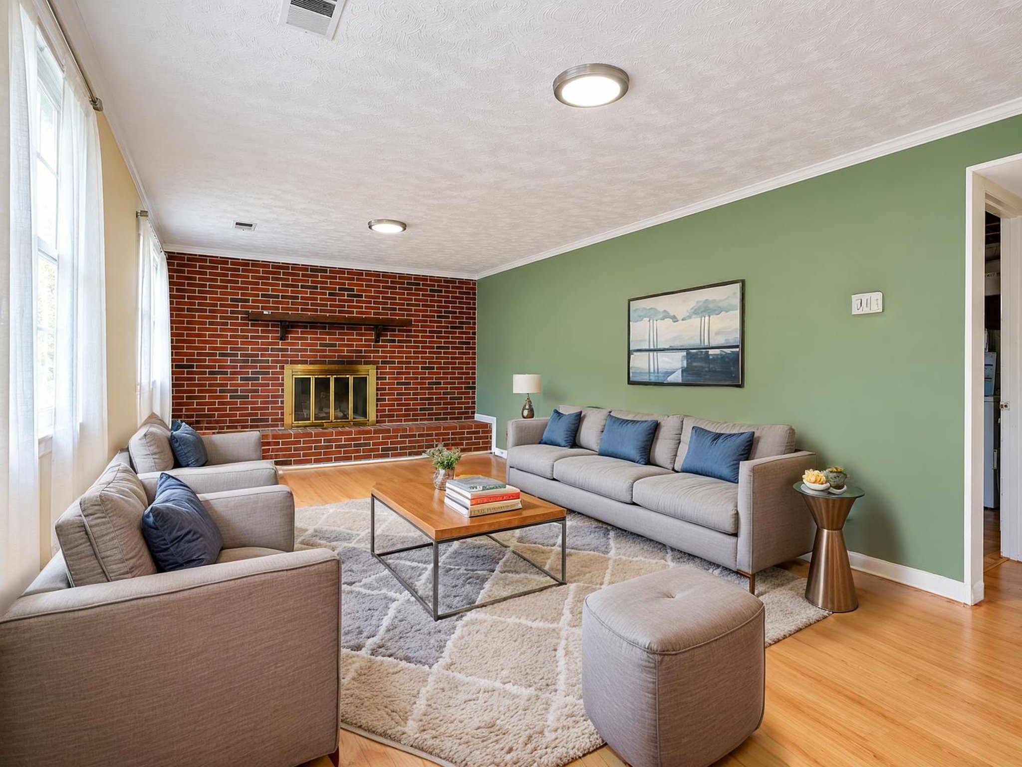 Spacious Green-Walled Living Room (2) virtually staged.jpeg